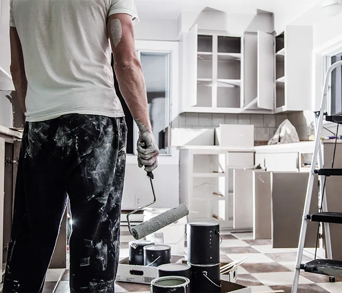 painter in kitchen